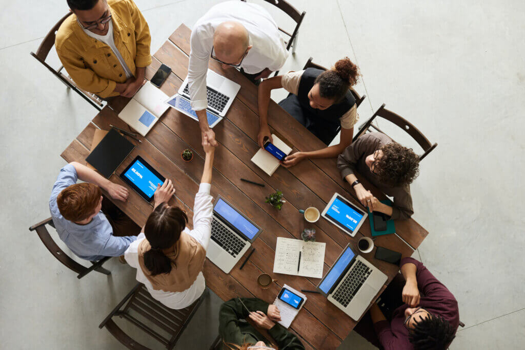 Team of wealth management professionals sitting around a table during a meeting